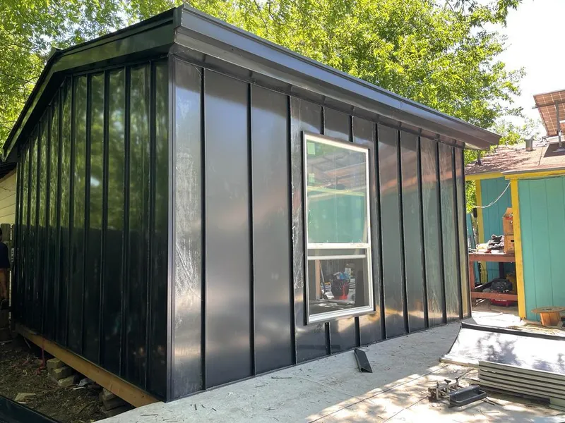 Black standing seam metal wall panels for Roof Inspection in Bourne