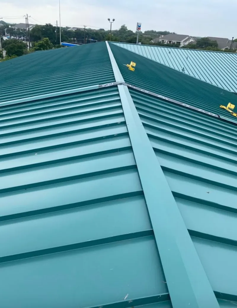 Green commercial metal roof ridge and valley for Metal Roof Repair in Bourne